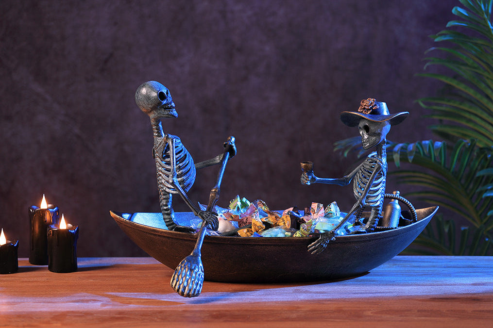 Two skeletons in a boat with a dark background