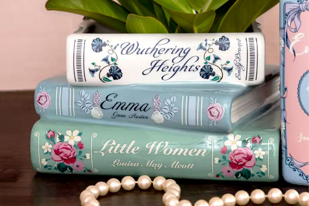 A planter shaped like a stack of three books, Wuthering Heights, Emma, and Little Women.