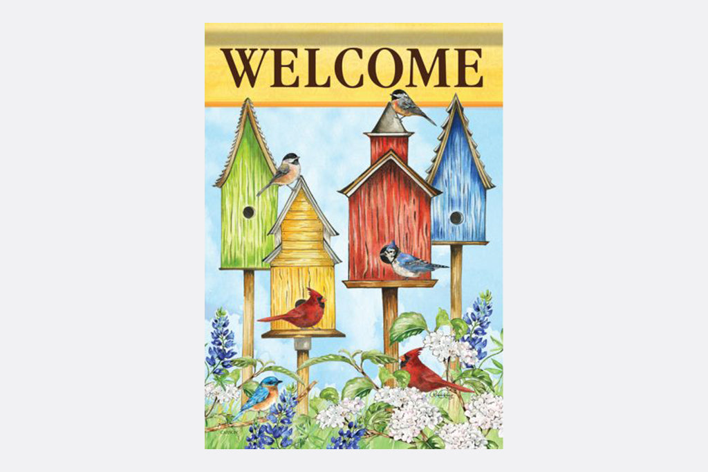 garden decor flag that says "Welcome" on yellow; a variety of songbirds and birdhouses amongst blooming bluebonnets shown as the main design