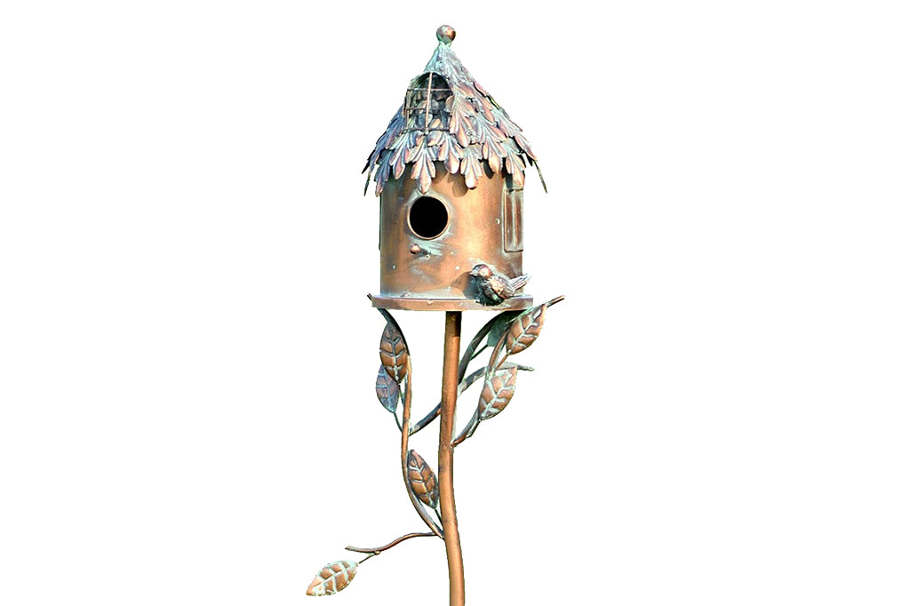 decorative metal birdhouse on a stake 