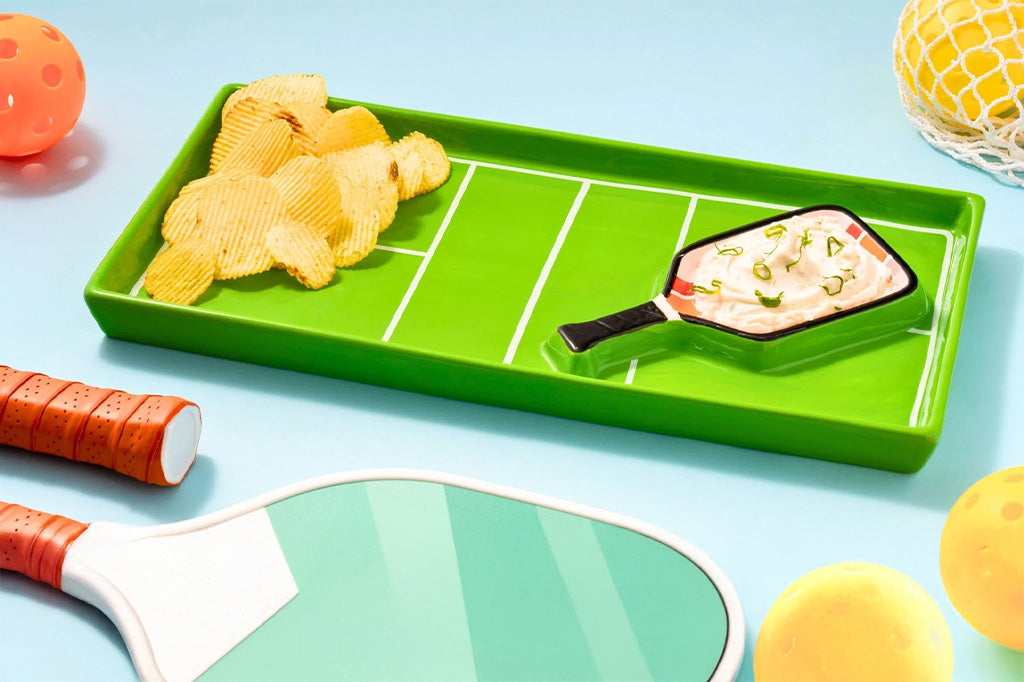 pickleball themed ceramic platter with embedded paddle-shaped dip bowl