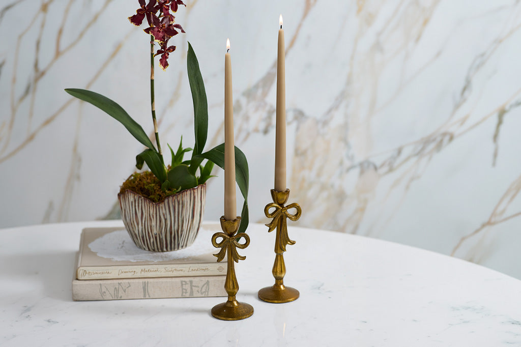 golden candle holders with christmas bows