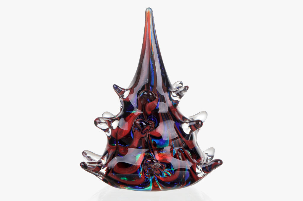 hand blown art glass Christmas tree in swirls of clear, blue, red, and green glass