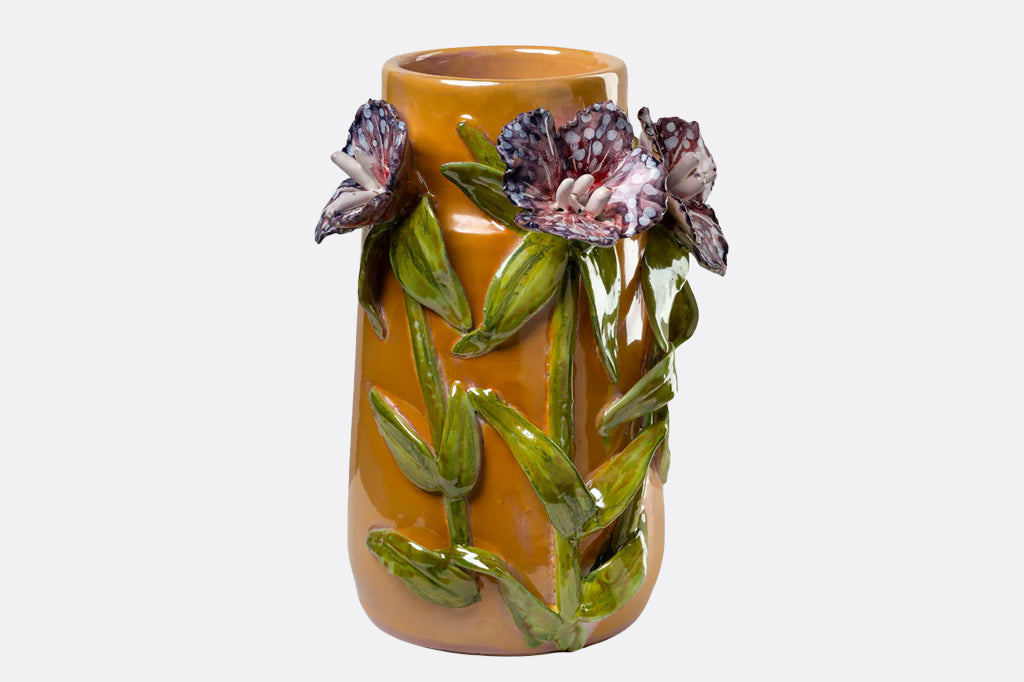 dark purple spotted 3-d sculptured flower on mango colored wide neck vase 
