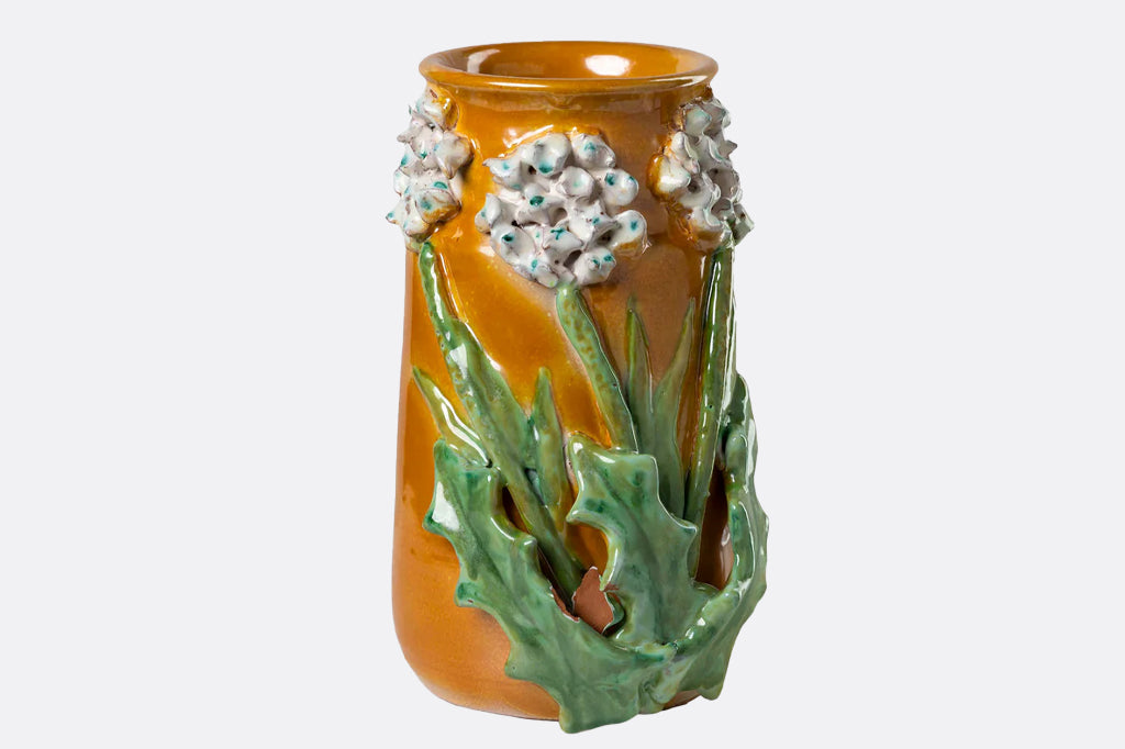 3-d flowers on mango colored vase 