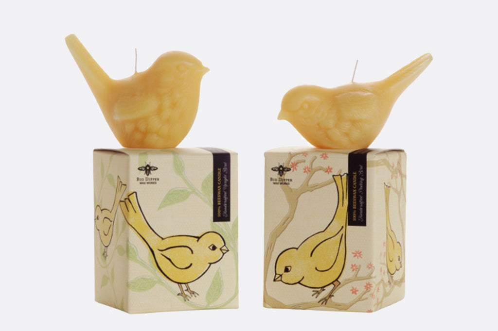 Pair of two beeswax bird candles sitting on box