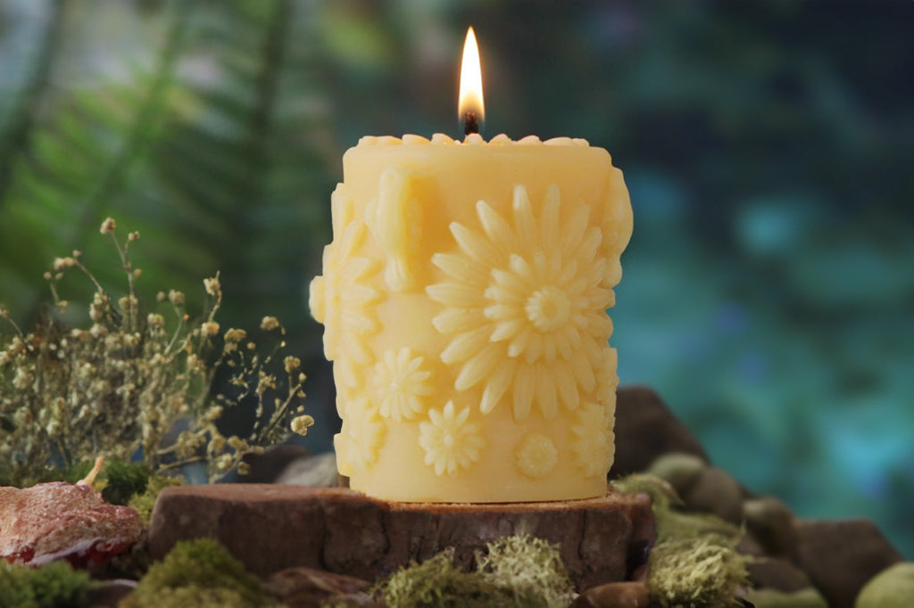 Beeswax pillar candle with dimensional flower and bird motifs 