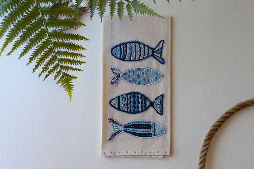 embroidered patterned fish, light blue dark blue and gray thread 