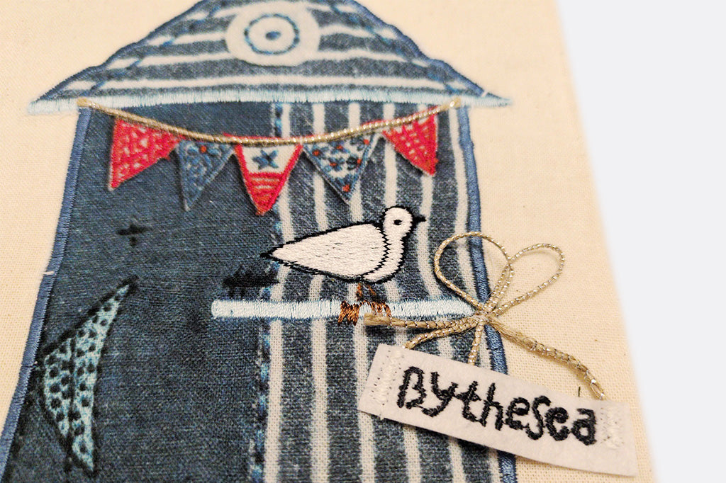  cotton dish towels with detailed applique and embroidery in coastal theme on a tea towel