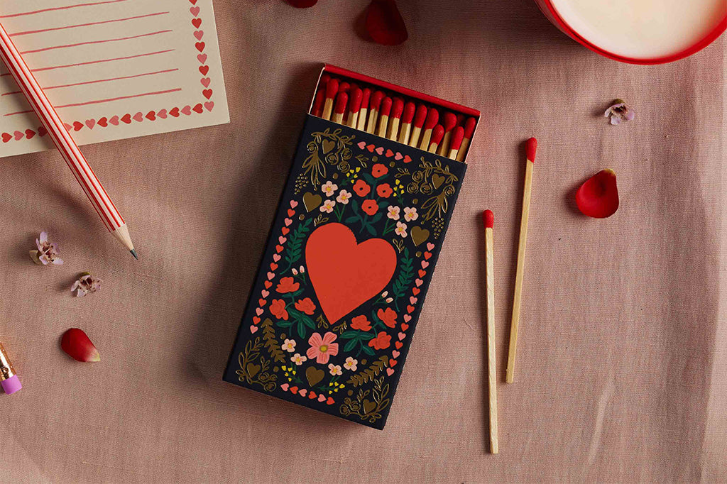 Matches with decorative box featuring a heart design