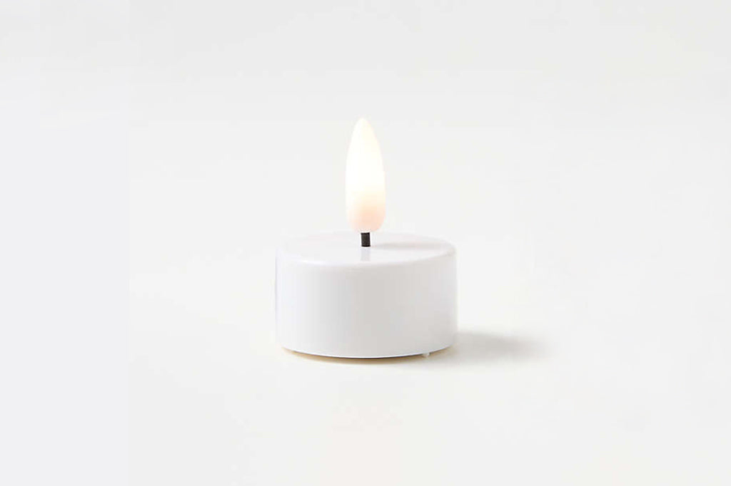 White LED tealight candle with light on