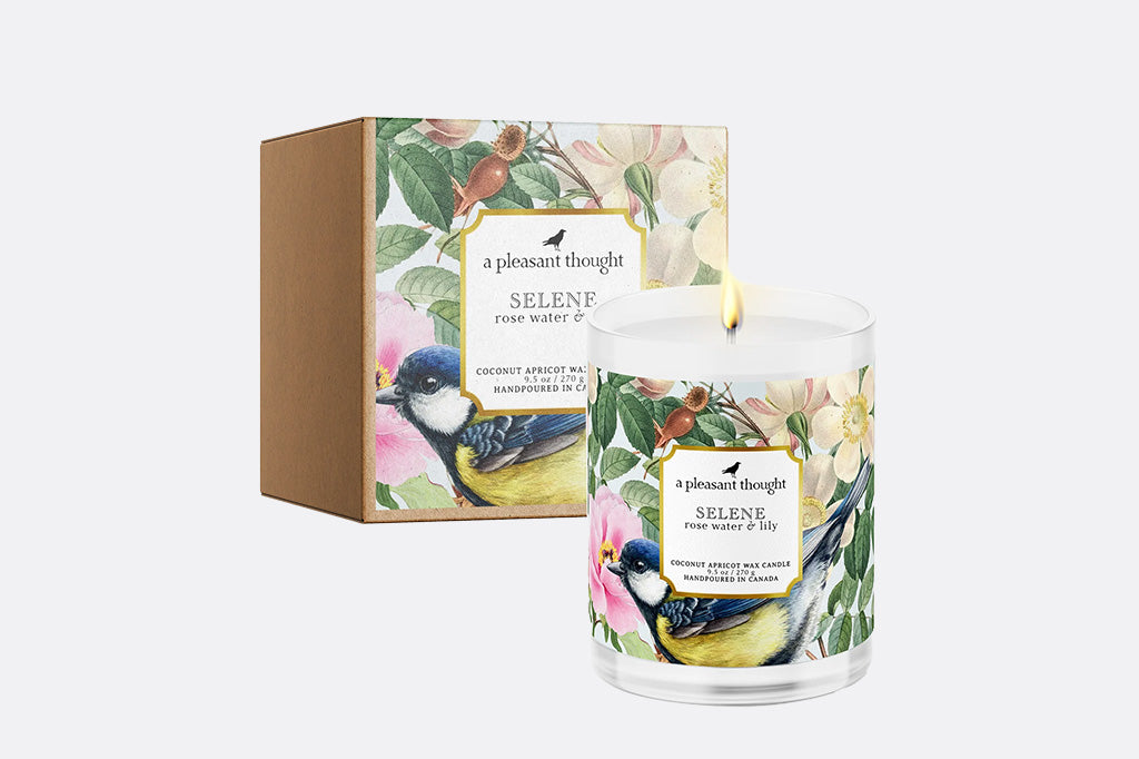 Selene rose water and lily scented candle shown with box