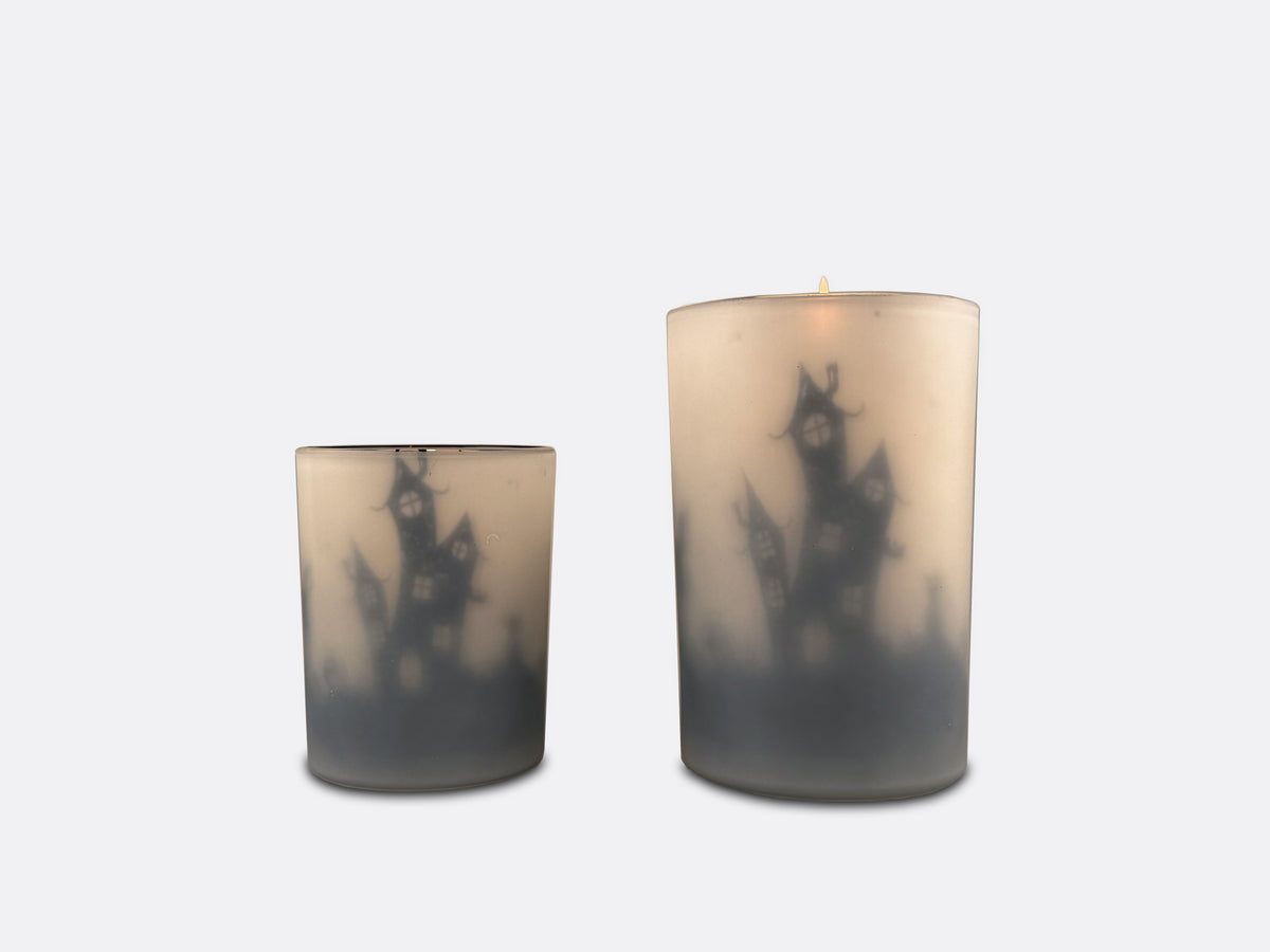 Two Halloween themed candle holders.