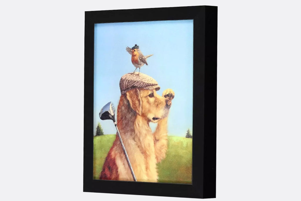Framed artwork of a dog with a golf club and a bird on its head.
