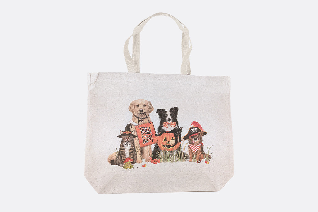 Tote bag with a design of four dogs in costumes on a white background