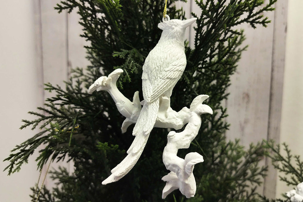 Close up detail of white bird ornament