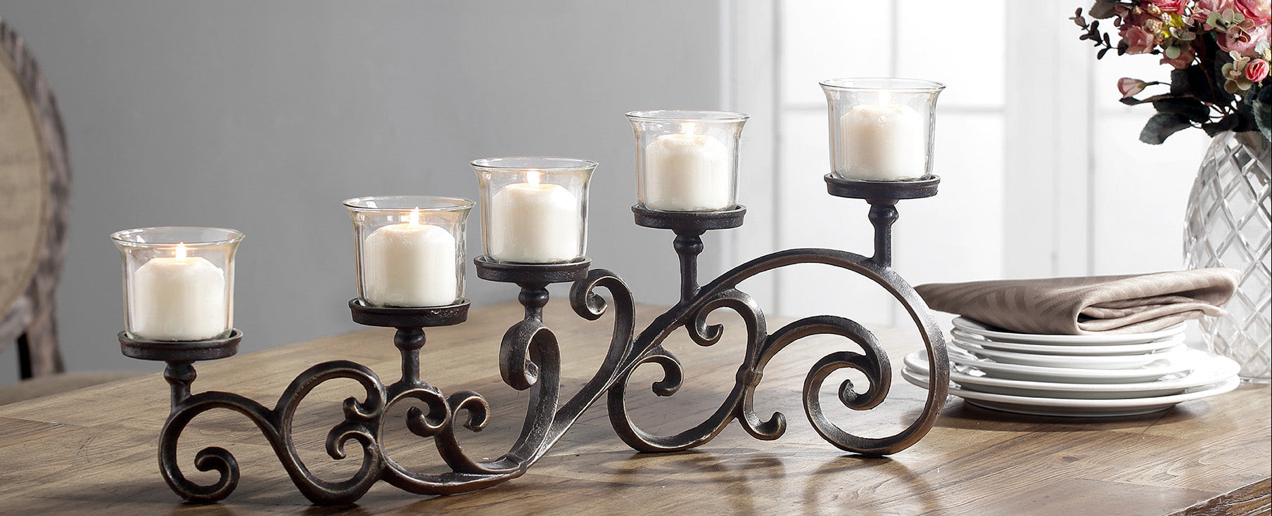 candelabra that holds 5 votive candles, cast metal scrollwork design