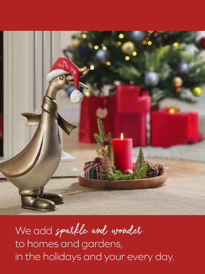 video for holiday decor, golden duck in santa outfit waddles across a room decorated for Christmas