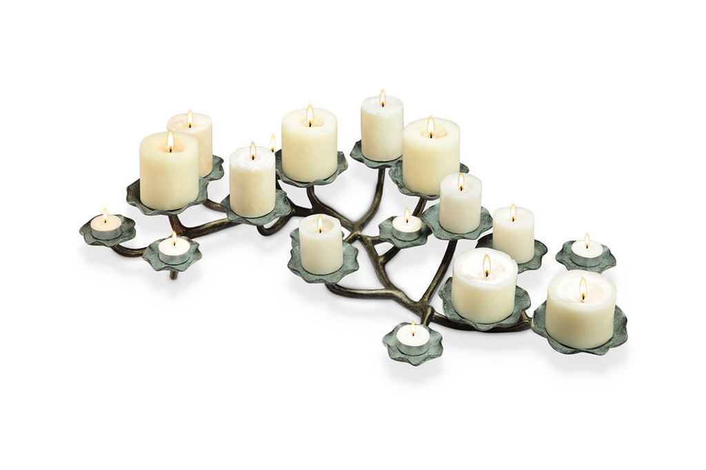 lily pad themed table candelabra holds a variety of candle sizes from pillar to tealight - shown with 17 candles in sizes from 3" to tealight on the lilypad platforms