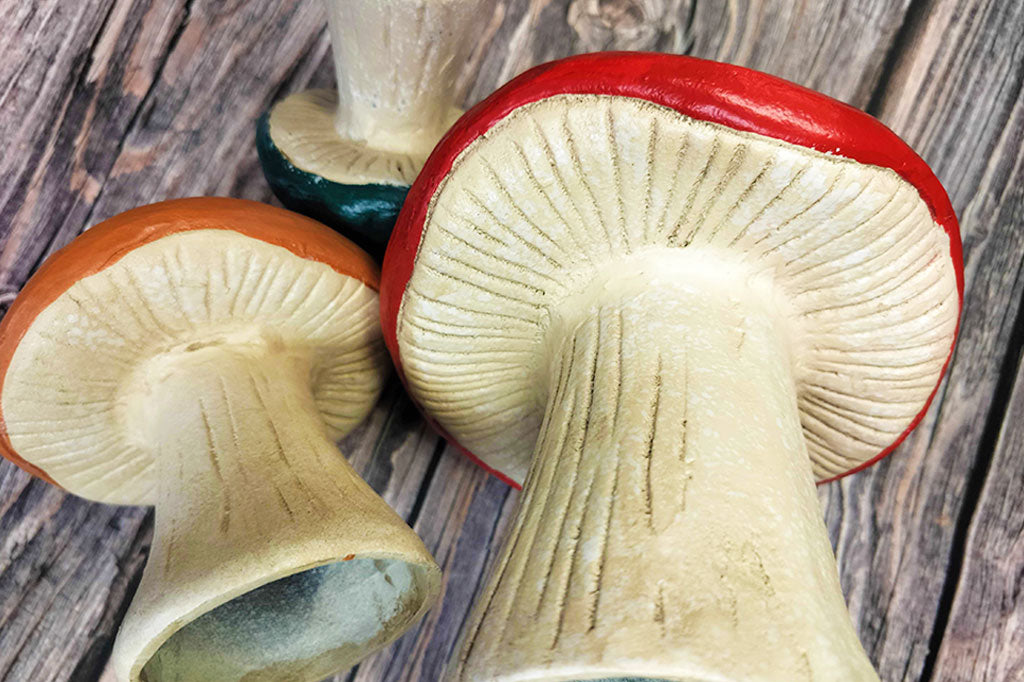 Close-up view of the sculpted cast metal detailing under the mushroom caps