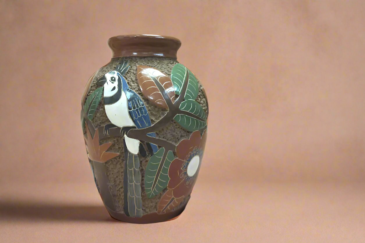 hand sculpted fair-trade pottery features blue jay