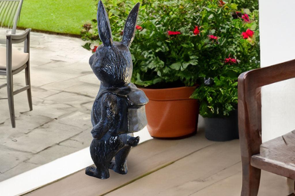 bunny sculpture shown on porch looking out at the driveway