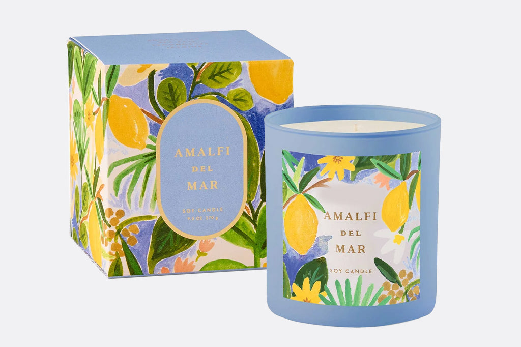 candle in blue lass container with lemon illustrations label, comes in matching lemon design box 