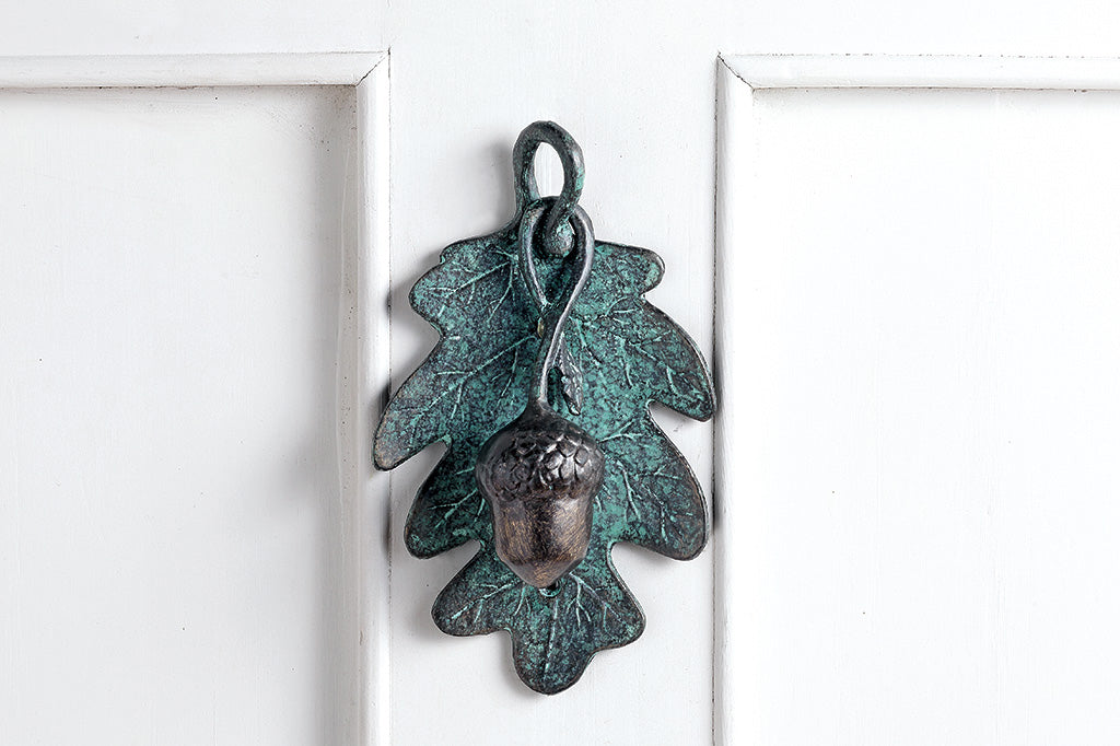 Green patina finish oak leaf door knocker with sculpted acorn knocker