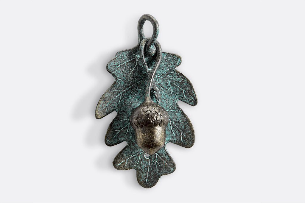 Green patina finish oak leaf door knocker with sculpted acorn knocker