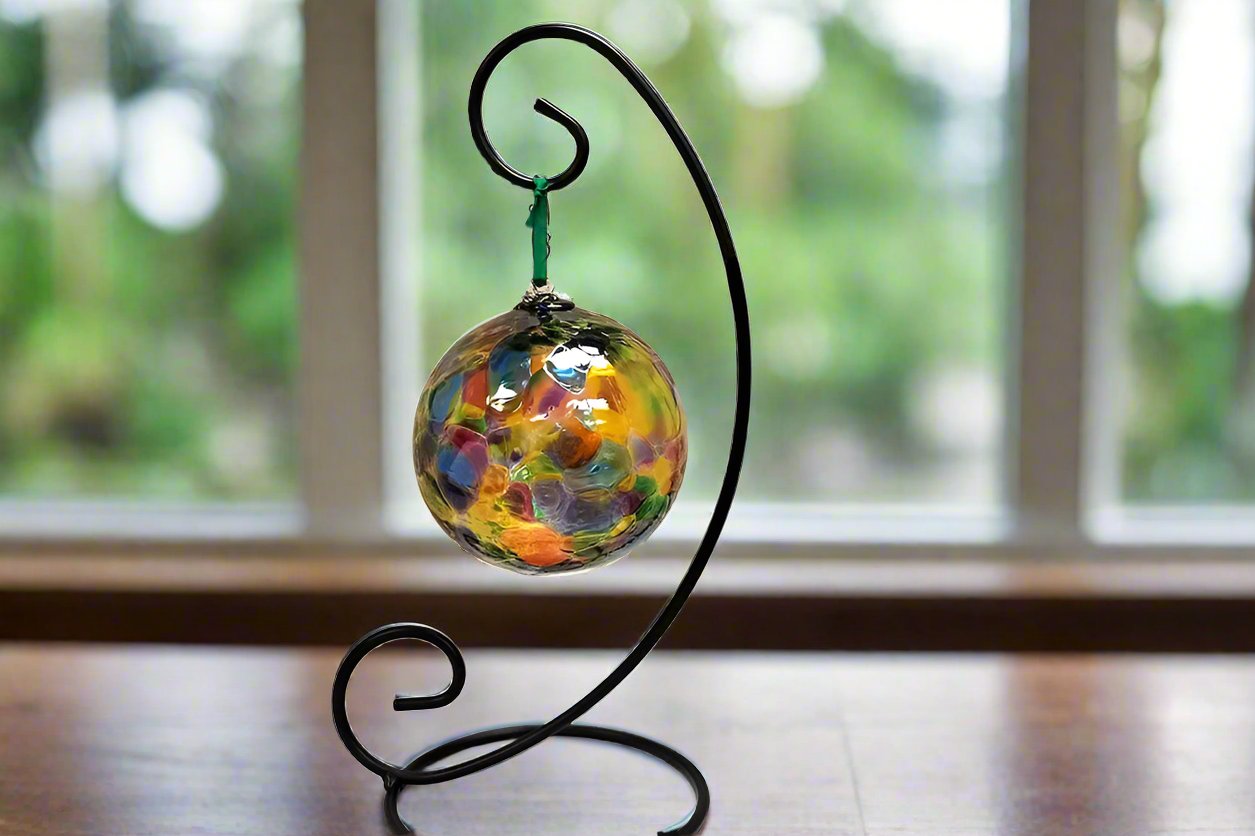 glass orb shown hanging by a kitchen window