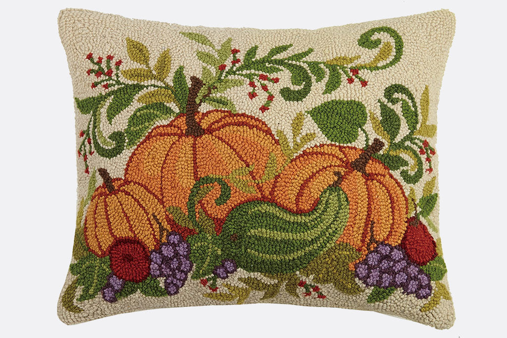 pumpkin trio on cream background with cornucopia style fruits and vegetables - hooked wool throw pillow