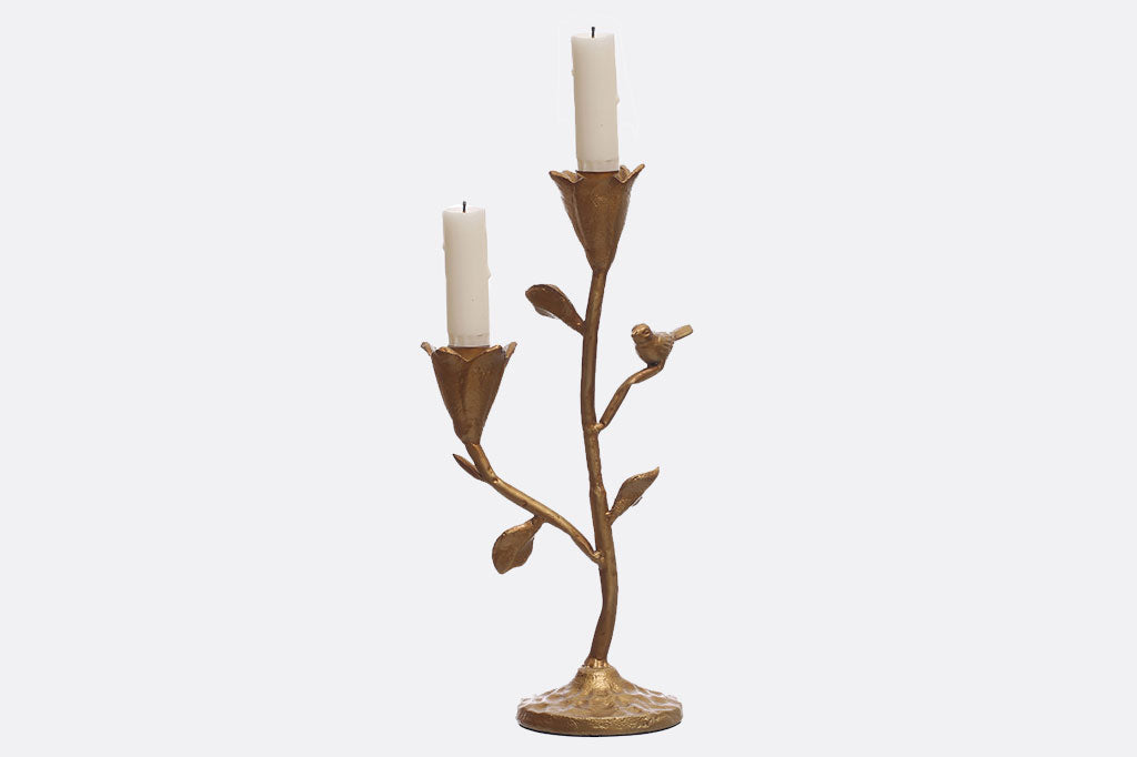 taper candelabra featuring floral cups to hold the candle and perched bird in a golden bronze finish