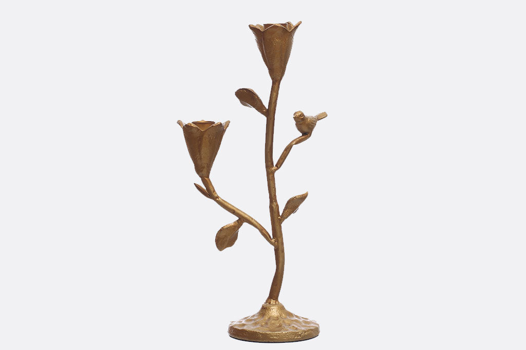 taper candelabra featuring 2 floral blossom cups to hold the candles and perched bird in a golden bronze finish