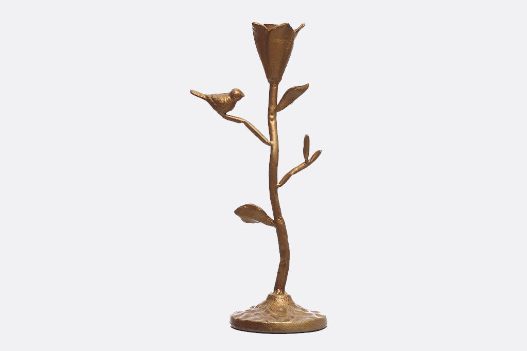 taper candelabra featuring floral cup to hold the candle and perched bird in a golden bronze finish