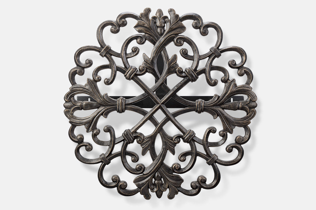 a wall-mounted hose holder featuring cast metal scrollwork