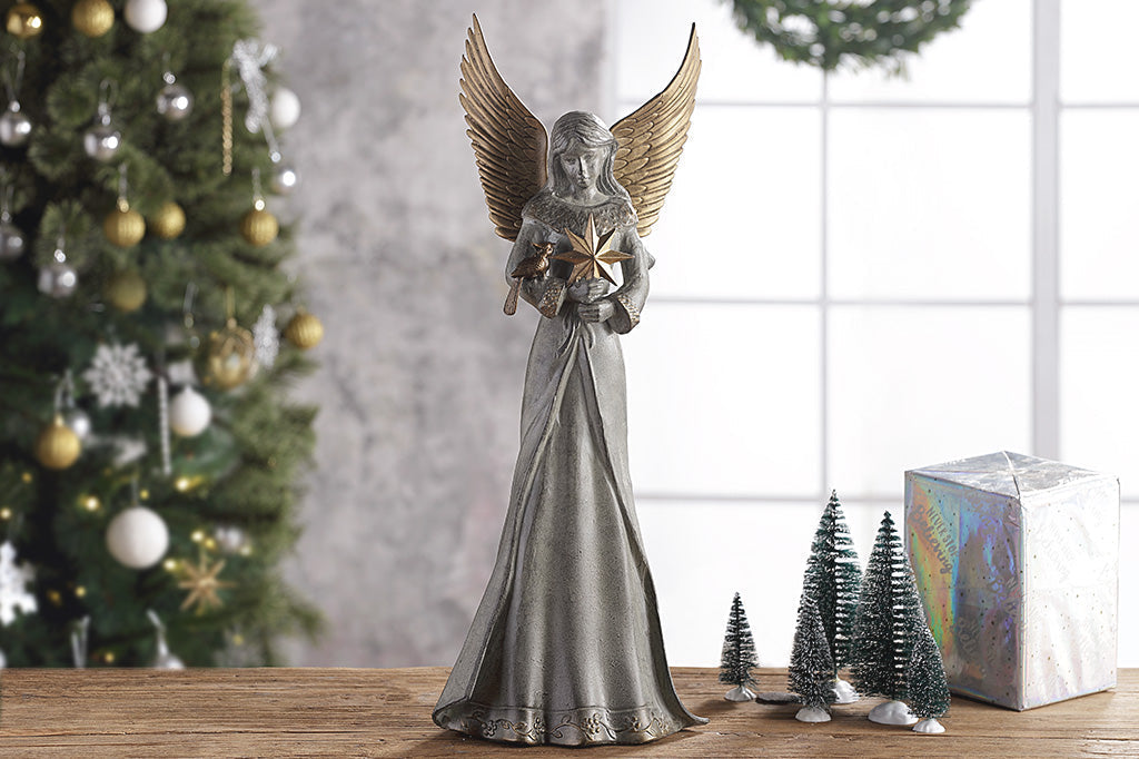 angel sculpture shown indoors as part of a holiday scene