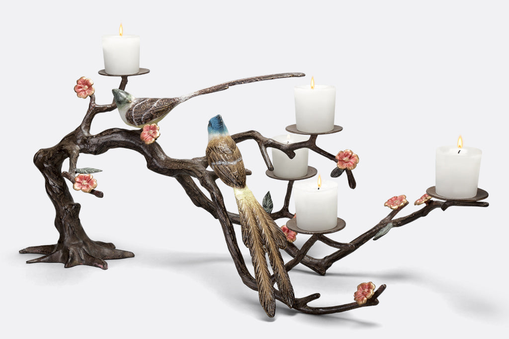 metal candelabra with branch and blossoms featuring two playful birds, holds up to 5 votive candles  