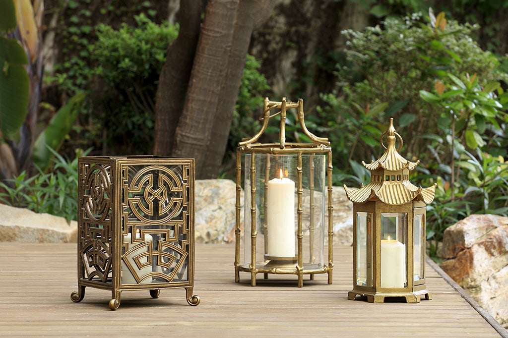 collection of three Asian inspired lanterns in gold and bronze finishes 