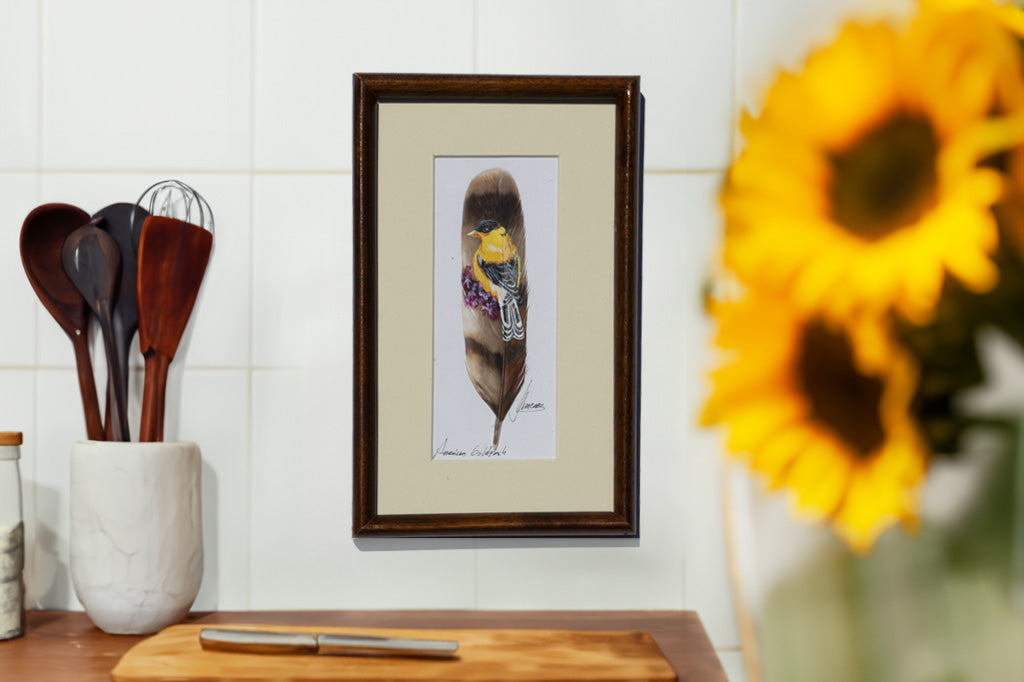 handpainted goldfinch on feather in frame