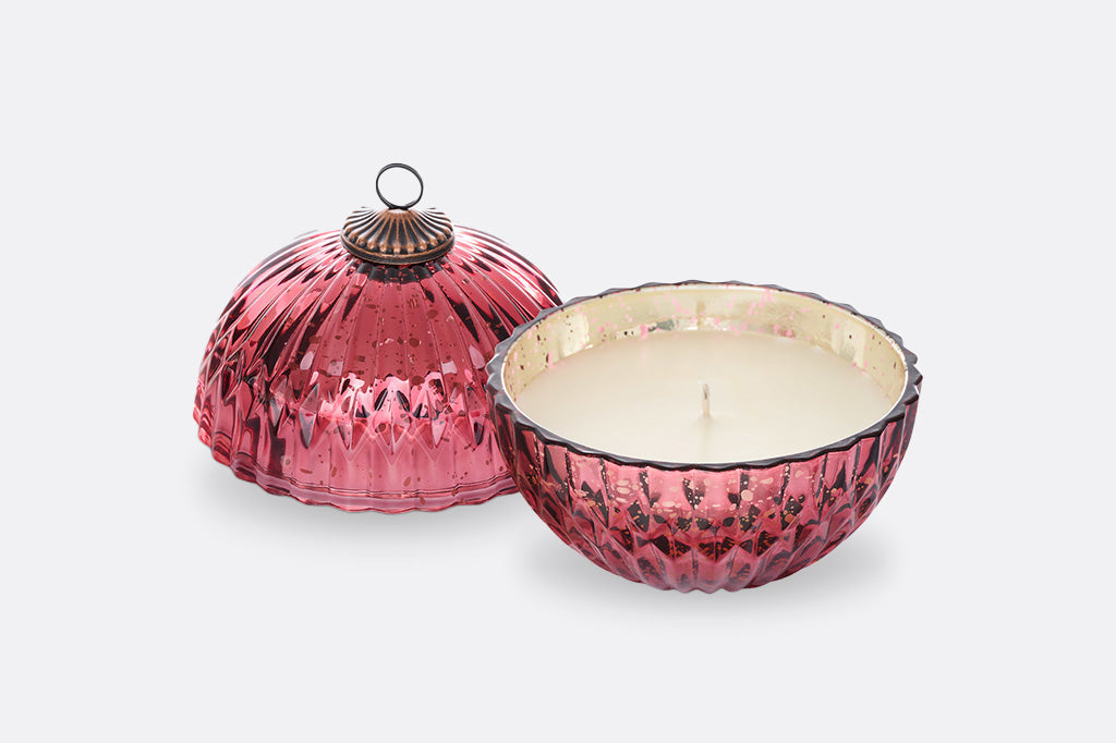 red candle ornament open with lid set to the side  