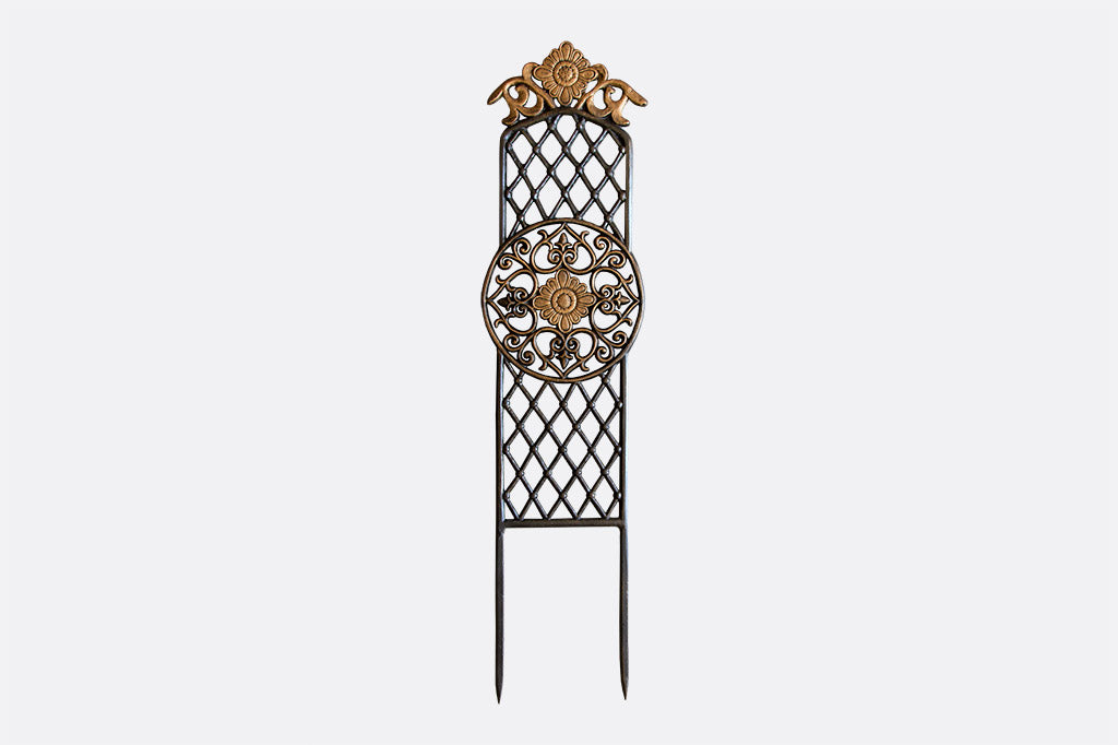 Mini trellis featuring classil scrollwork and a floral mediallion feature in the middle of cast-metal lattice