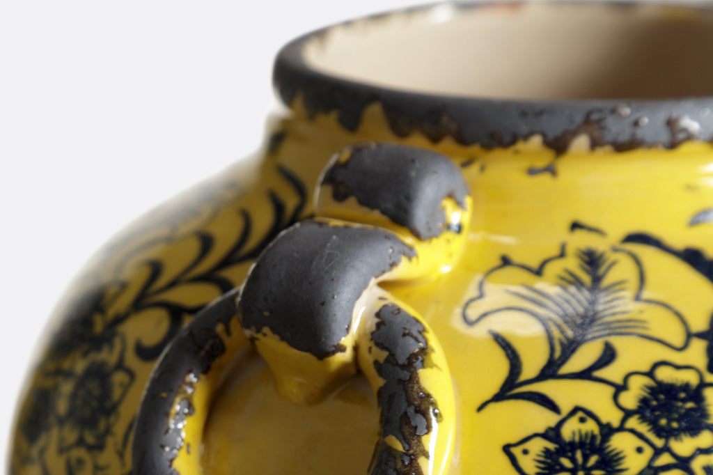close-up of faux handles in grey and yellow glaze