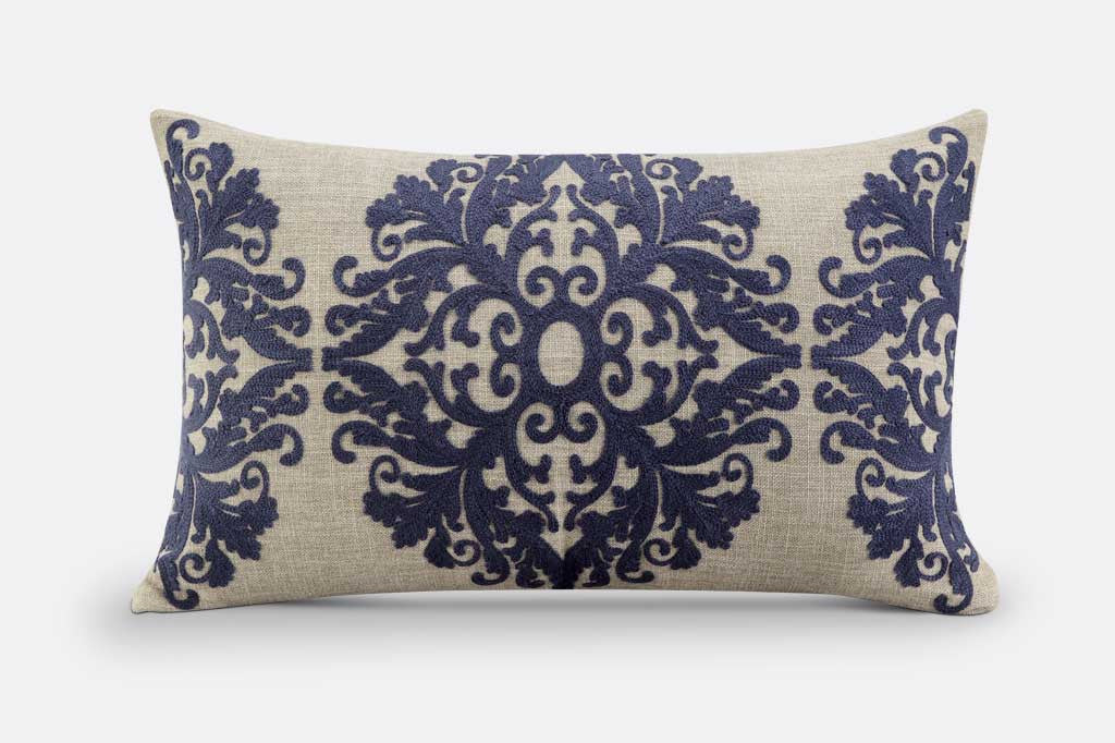 pillow with raised damask blue motif, lumbar shaped