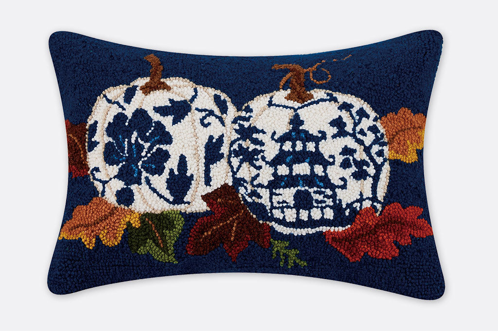 hooked wool pillow with pumpkin and leaf design with asian accents in blue and white