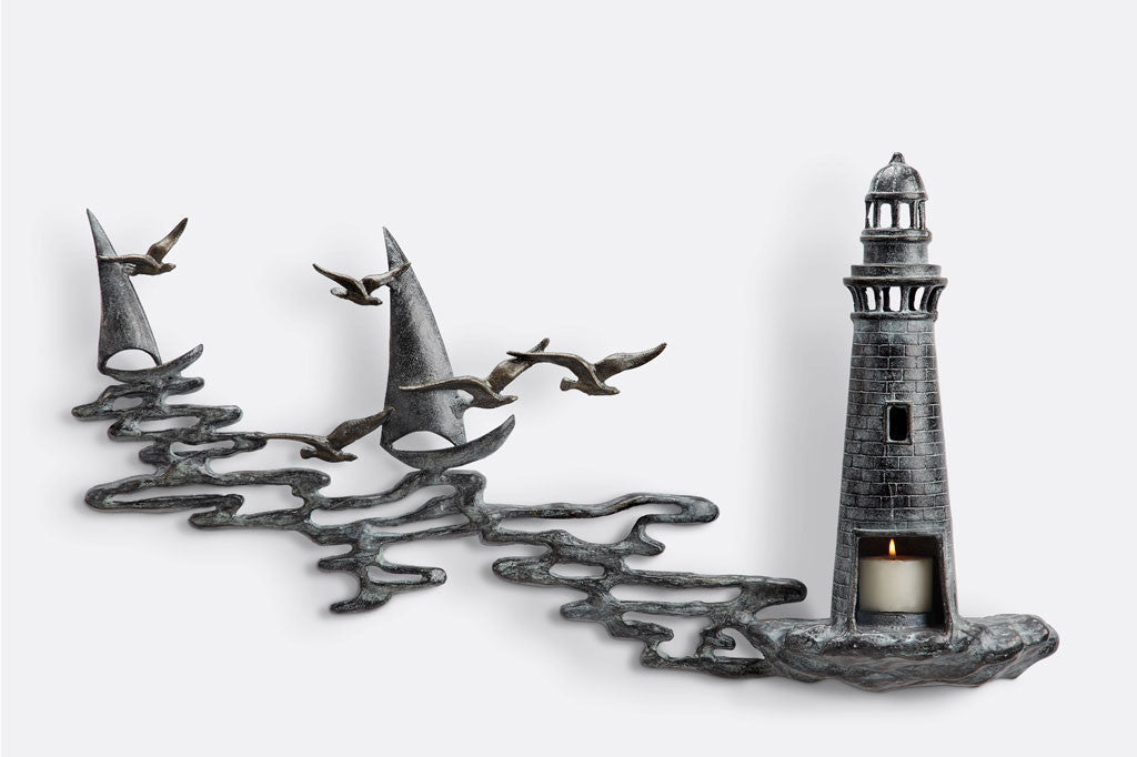 Wall art Votive holder cast metal sculpture of Lighthouse by the sea with 2 sail boats
