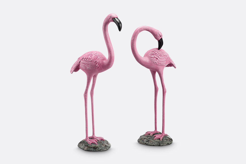 two cast metal pink flamingos