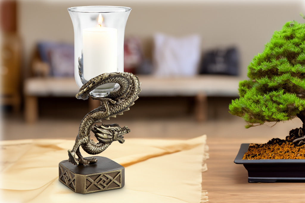 Ming Dragon Hurricane Candle Holder on table with bonsai tree