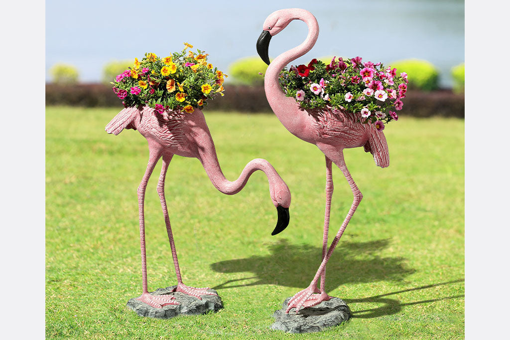 flamingo planters shown with petunias