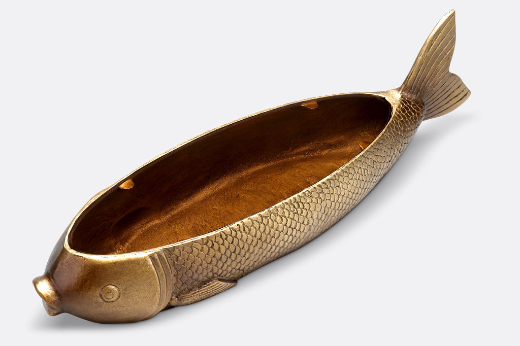 Golden fish sculpture is hollow with amber glass tray topper