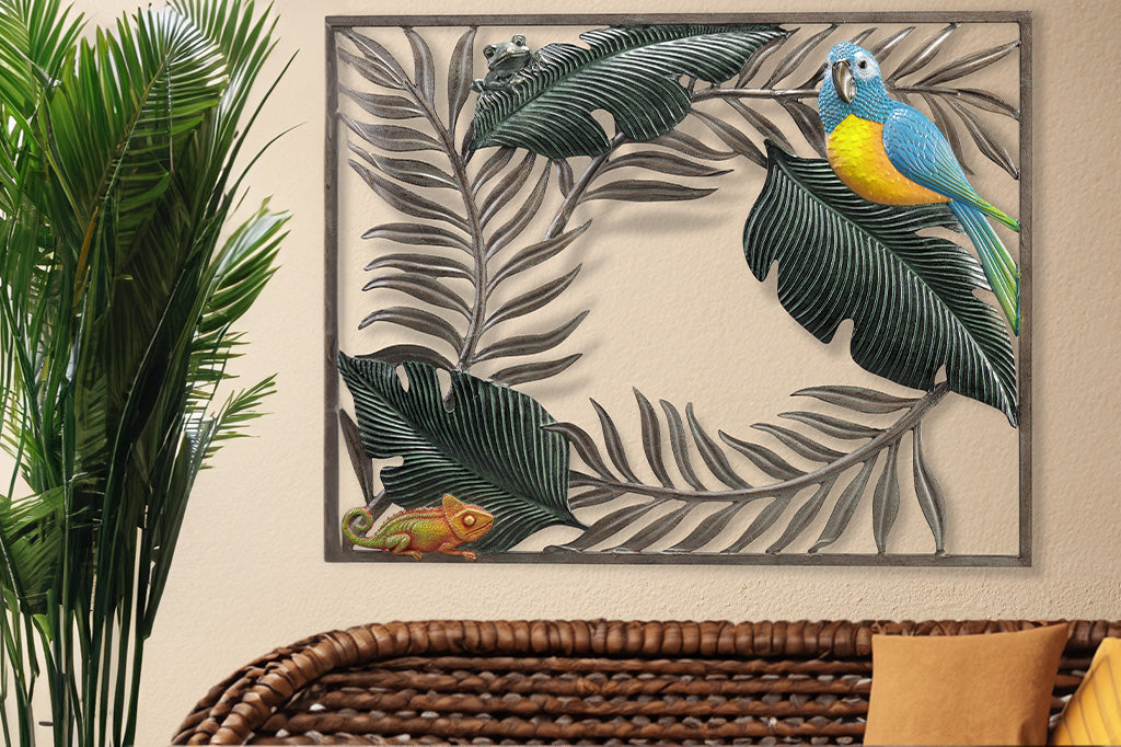 large wall plaque featuring a parrot, frog, and chameleon on a wall above a rattan couch and indoor potted palm plant